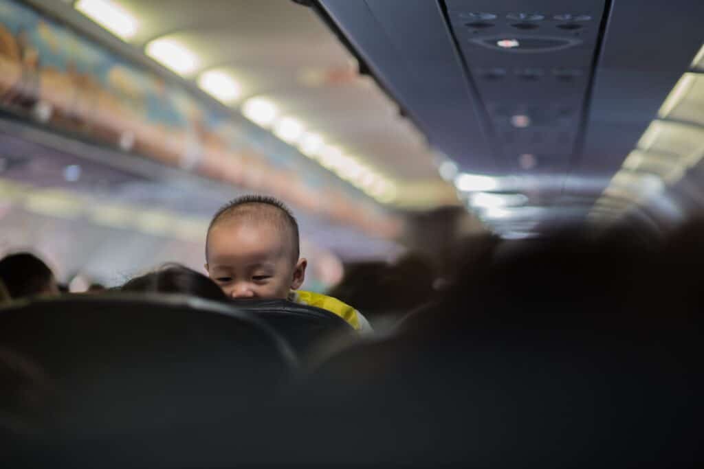 Baby on lap on airplane