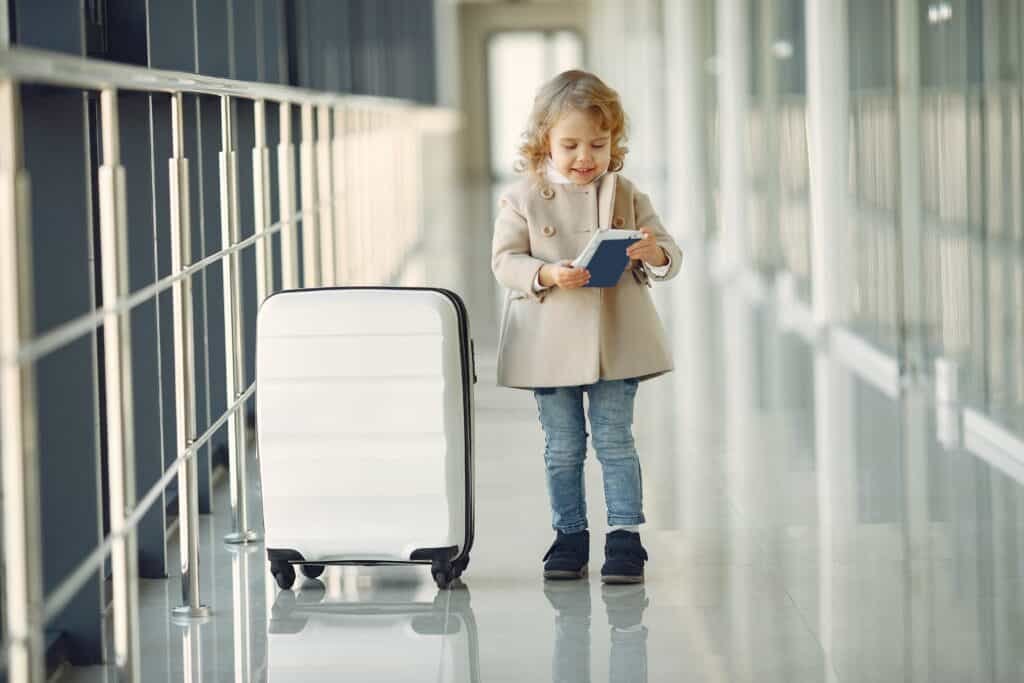 Child with passport at airport
